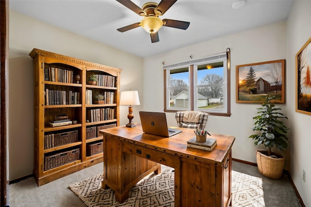 carpeted office with ceiling fan