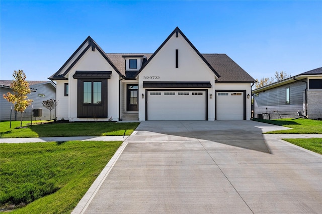 modern inspired farmhouse featuring a front yard and a garage