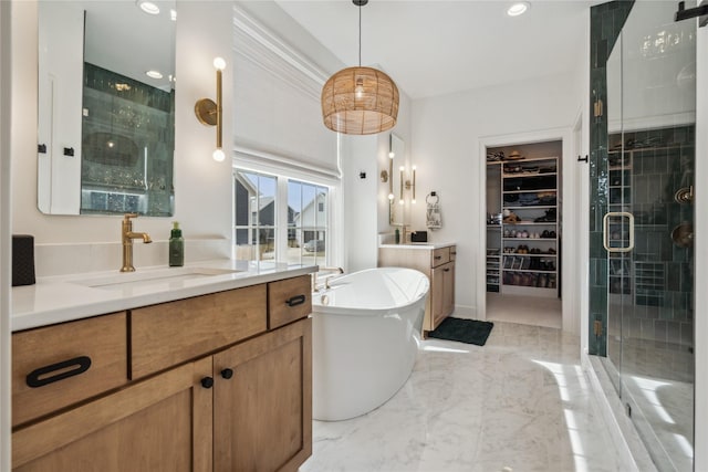 bathroom featuring vanity and shower with separate bathtub