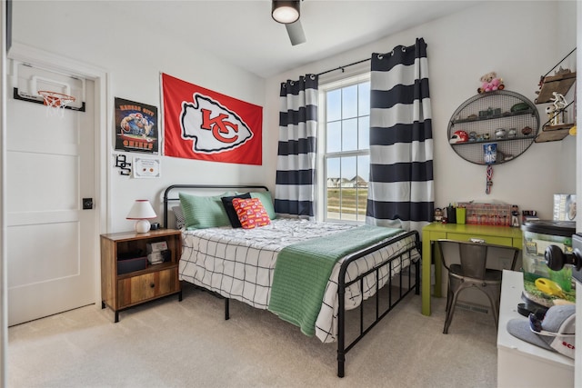 carpeted bedroom with ceiling fan