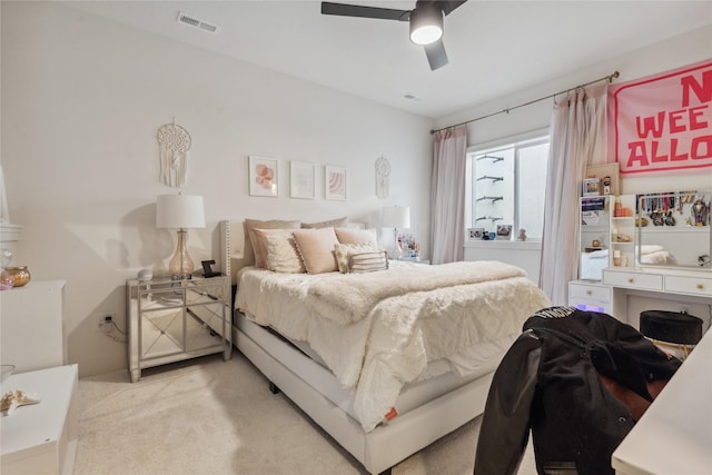 carpeted bedroom featuring ceiling fan