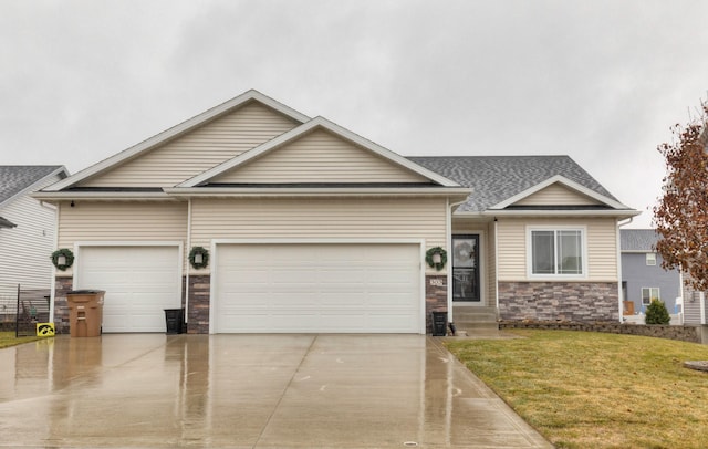 view of front of property with a front yard and a garage