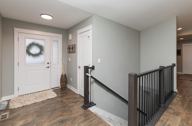 entrance foyer featuring dark wood-type flooring