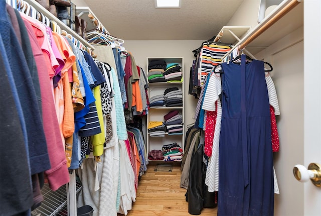 walk in closet featuring light hardwood / wood-style floors