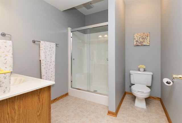 bathroom featuring vanity, toilet, an enclosed shower, and tile patterned flooring