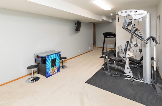 exercise area featuring carpet flooring