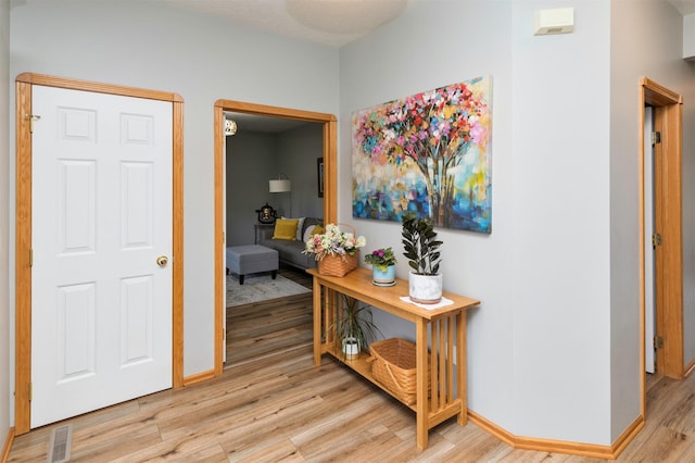 hall with light wood-type flooring