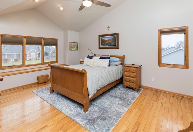 bedroom featuring light hardwood / wood-style flooring, high vaulted ceiling, and ceiling fan