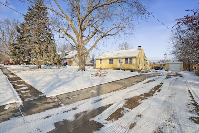 view of front of home featuring an outbuilding and a garage