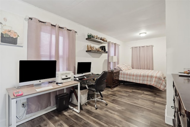 bedroom with dark wood-type flooring