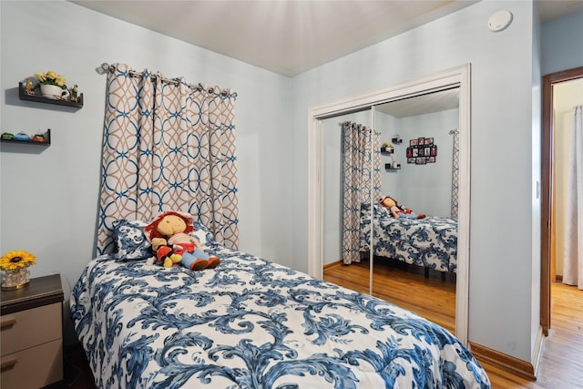 bedroom featuring a closet and light wood-type flooring