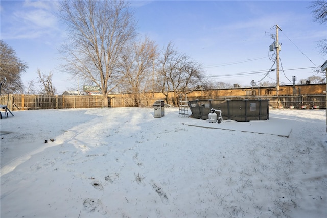 view of yard layered in snow