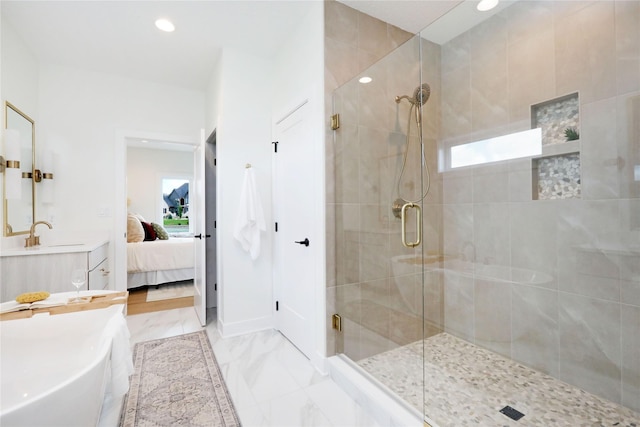 bathroom with vanity and a shower with door