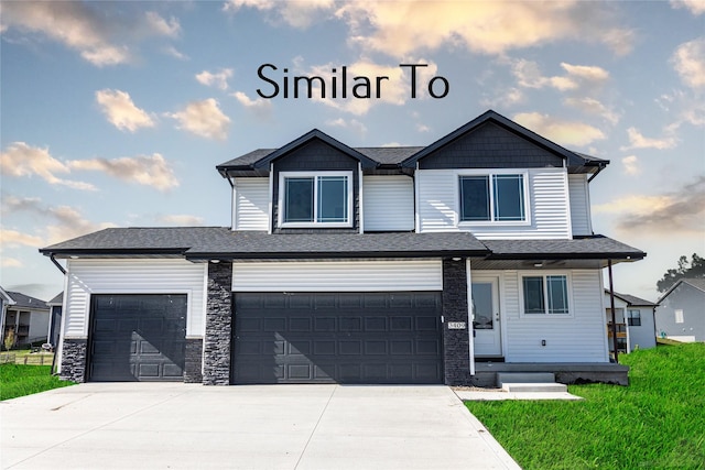 view of front facade with a front yard and a garage