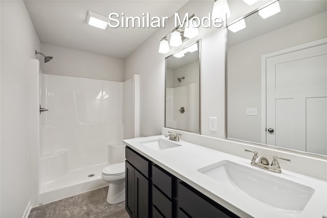 bathroom with a shower, vanity, and toilet