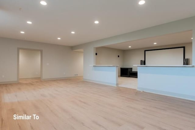 unfurnished living room with light hardwood / wood-style flooring