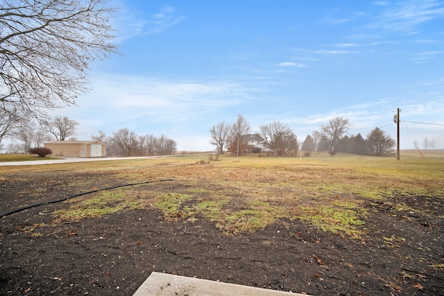 view of yard with a rural view