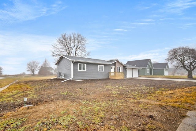 single story home with a garage