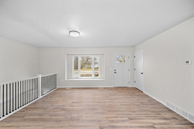 empty room with light wood-type flooring