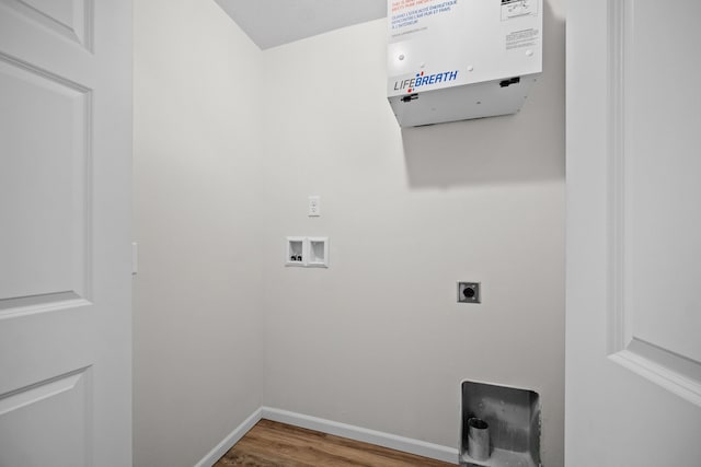 washroom featuring wood-type flooring, washer hookup, and hookup for an electric dryer