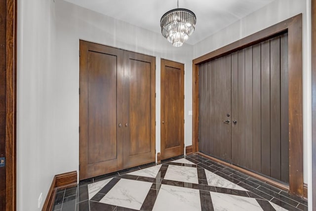 entrance foyer with a chandelier