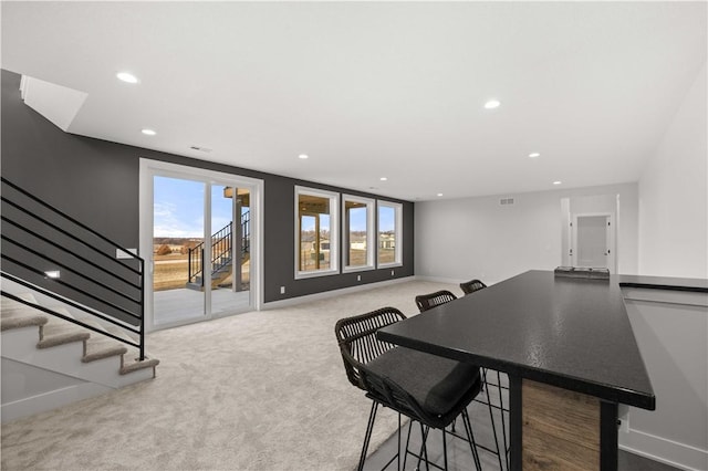 dining room featuring carpet floors