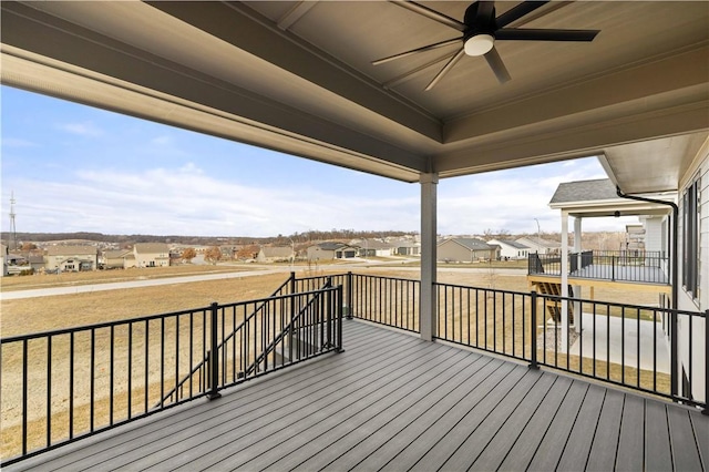 wooden deck featuring ceiling fan