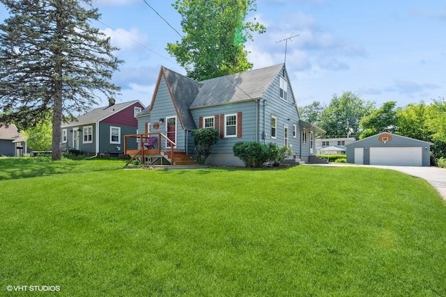 view of front facade with a garage, a front lawn, and an outdoor structure