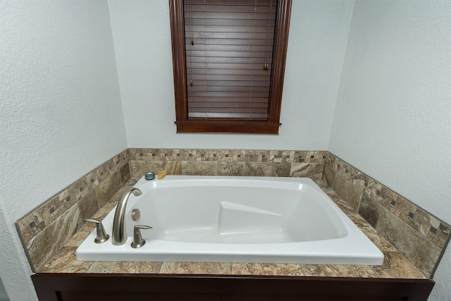 bathroom featuring a tub to relax in