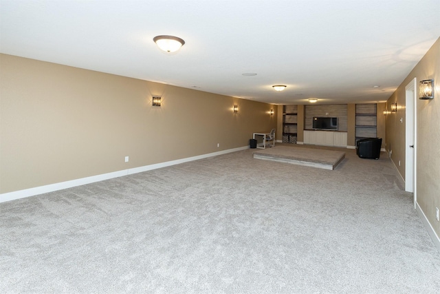 unfurnished living room featuring carpet floors