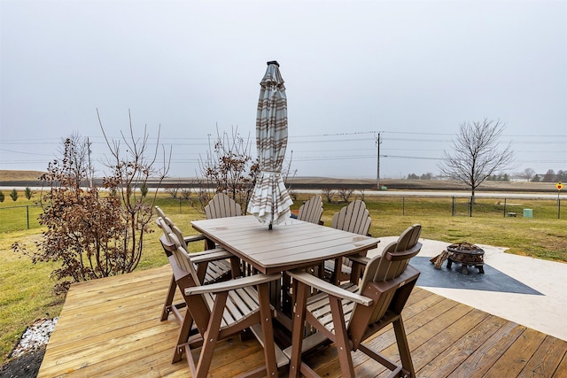 deck with a yard and an outdoor fire pit