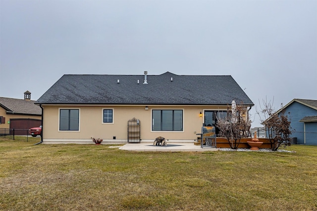 rear view of property with a patio area and a yard