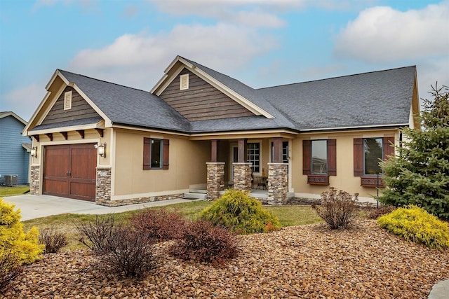 3513 Sunstone Ct SE, Altoona, IA 50009 - craftsman inspired home featuring covered porch, stone siding, a shingled roof, and a garage
