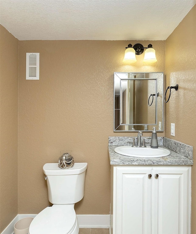 3513 Sunstone Ct SE, Altoona, IA 50009 - bathroom featuring vanity, a textured ceiling, and tile patterned flooring
