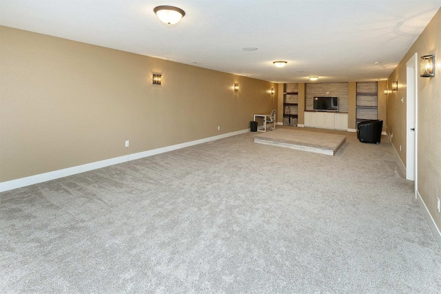 3513 Sunstone Ct SE, Altoona, IA 50009 - unfurnished living room featuring a fireplace, carpet floors, and built in shelves