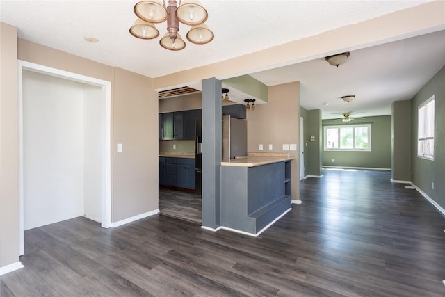 kitchen featuring dark wood-type flooring, ceiling fan, and a textured ceiling