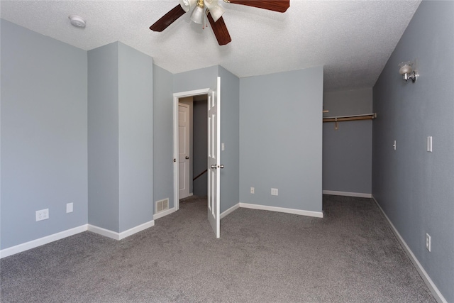 unfurnished bedroom with carpet floors, a textured ceiling, ceiling fan, and a closet