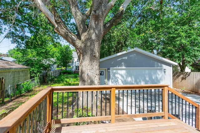 wooden deck with an outbuilding and a garage