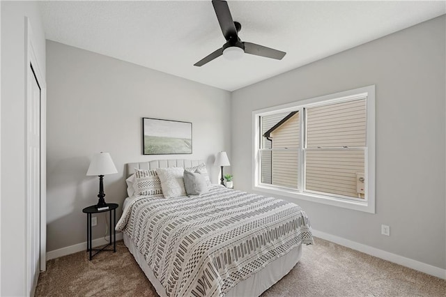 bedroom featuring baseboards, carpet, and a ceiling fan