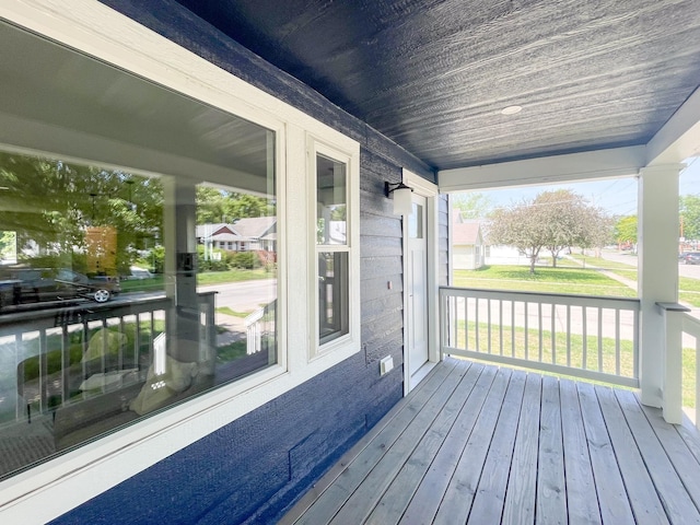 wooden terrace featuring a porch