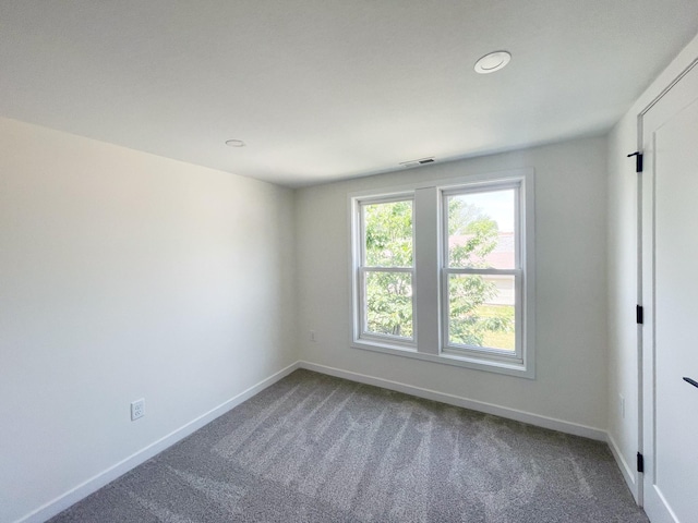 unfurnished room featuring carpet floors