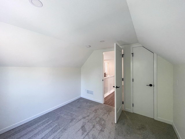 bonus room featuring carpet flooring and lofted ceiling