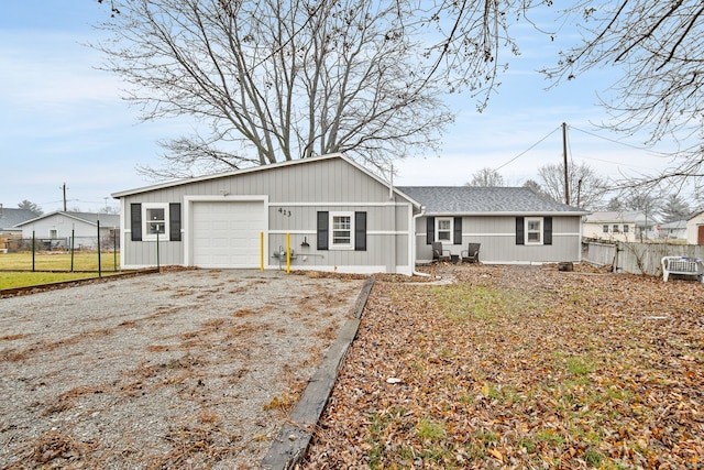 back of property featuring a garage