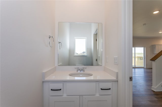 bathroom featuring vanity and wood-type flooring