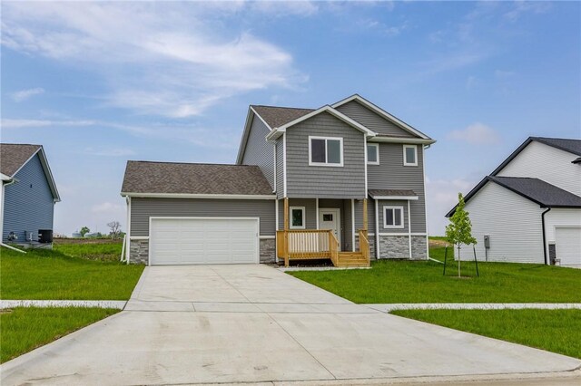 view of front of house featuring a front yard and a garage