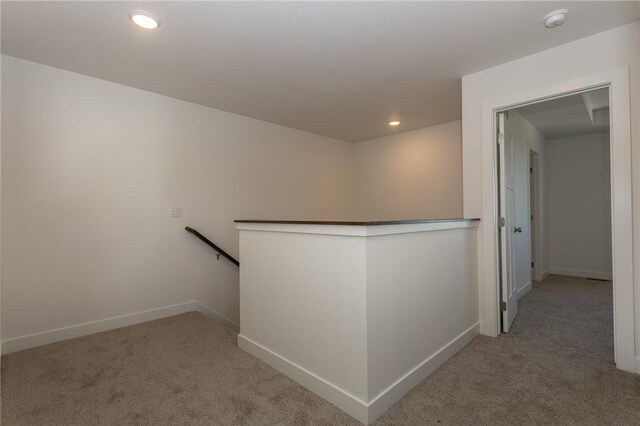 hallway with carpet flooring