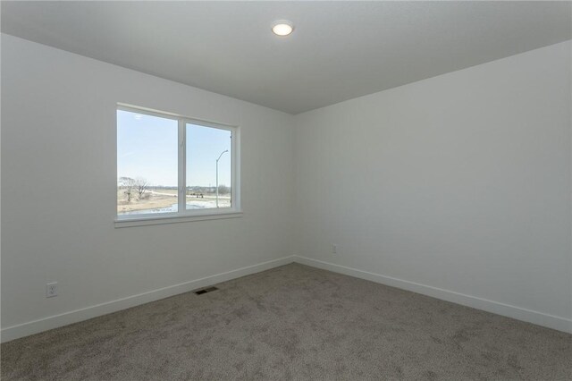 empty room featuring carpet flooring