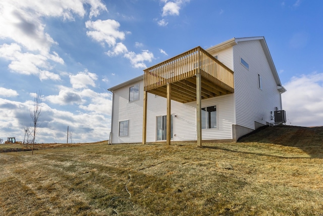 985 11th St, Waukee, IA 50263 - rear view of house featuring central air condition unit, a yard, and a wooden deck