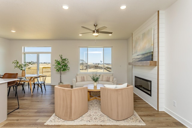 985 11th St, Waukee, IA 50263 - living room with a wealth of natural light, recessed lighting, a fireplace, and ceiling fan