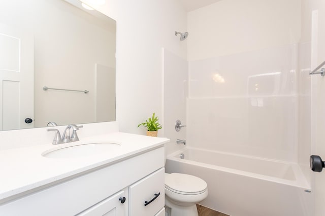 985 11th St, Waukee, IA 50263 - full bathroom with toilet, shower / bathtub combination, vanity, and wood finished floors